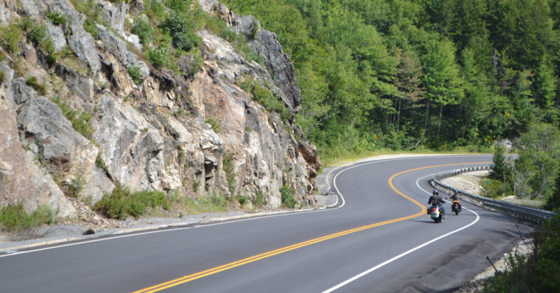 Pair of motorcycles on scenic highway